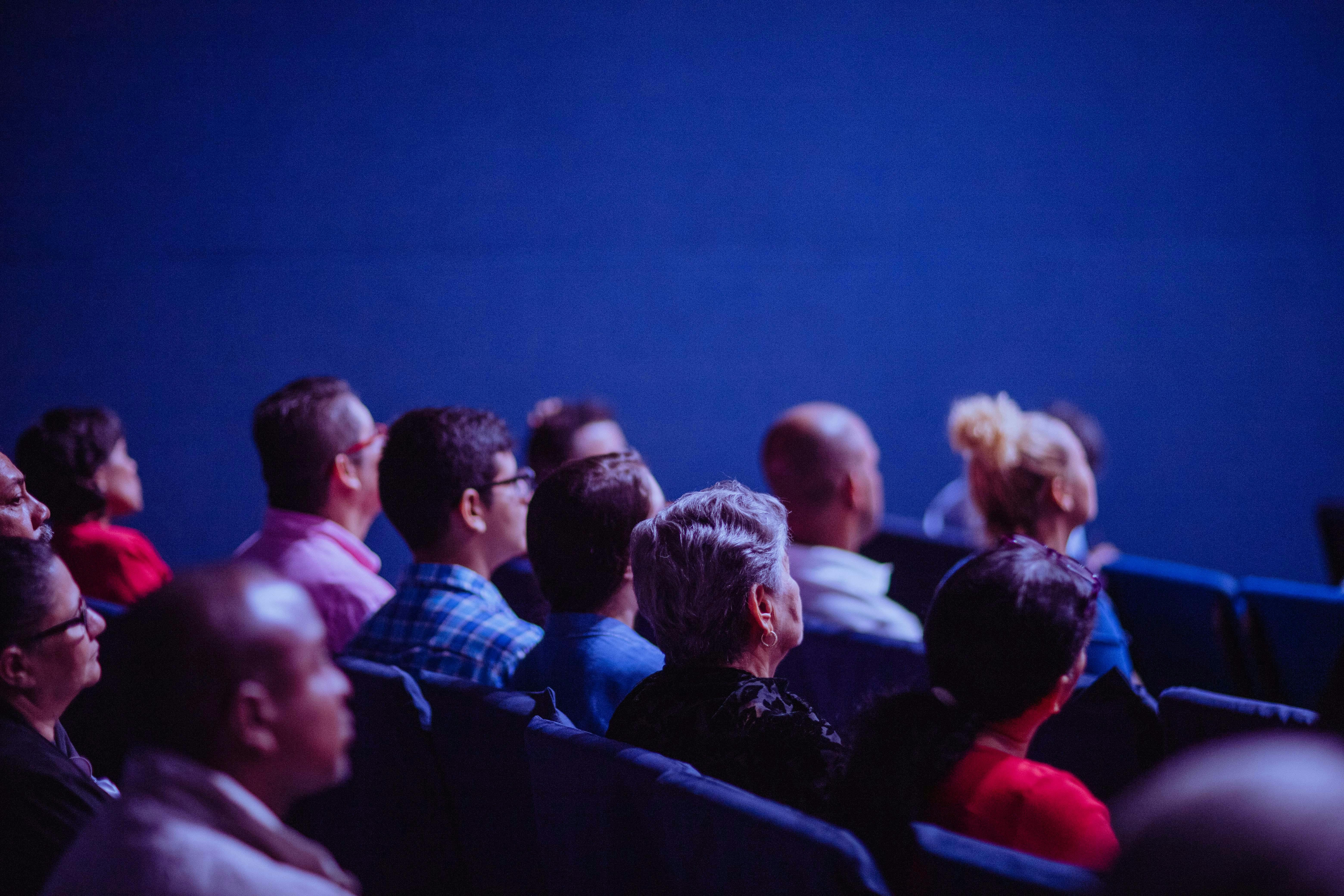 People Sitting inside the Auditorium